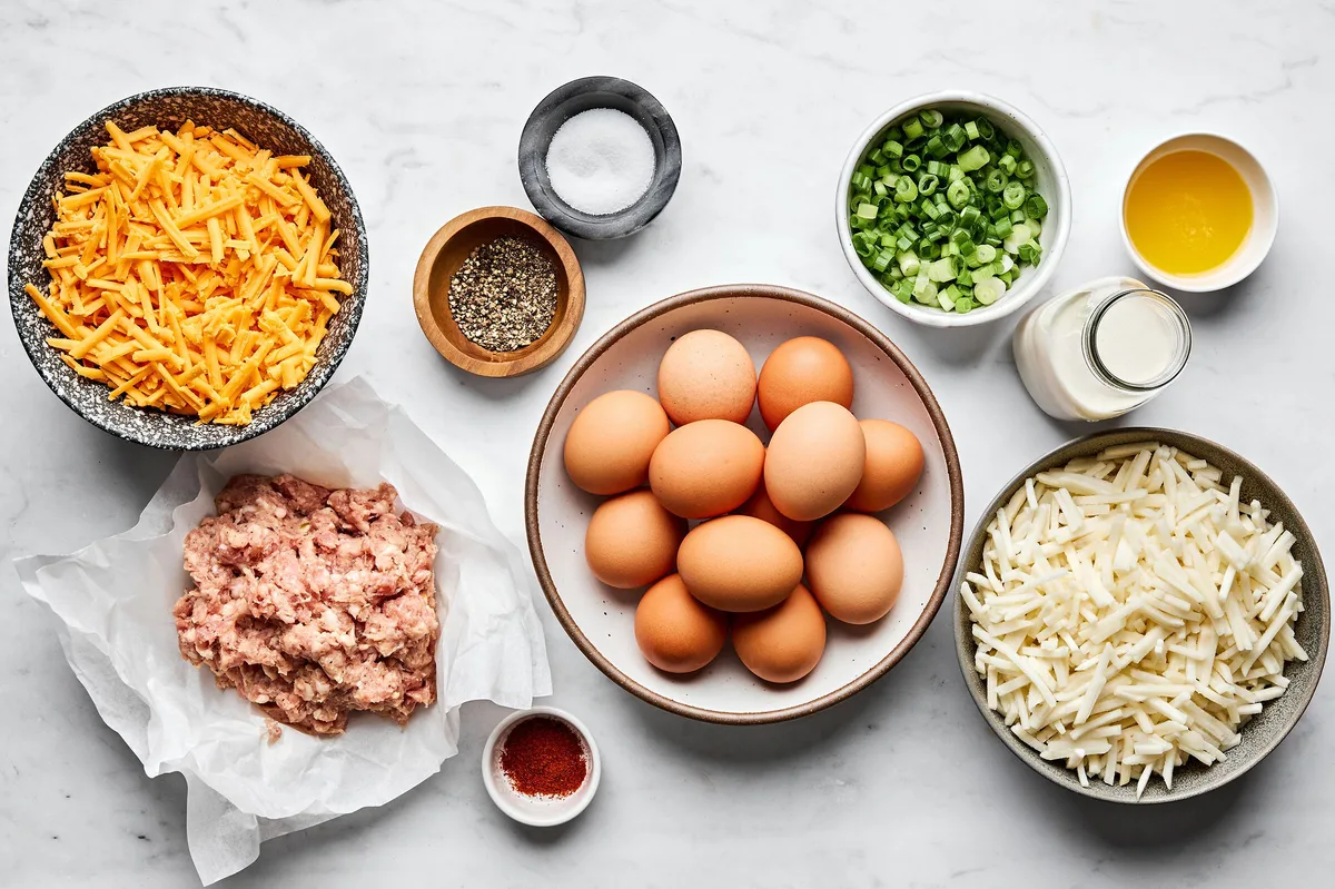 all the ingredients for a sausage breakfast casserole measured and laid out on the counter