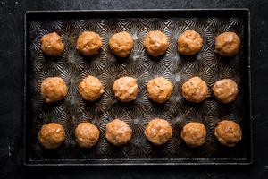 raw chicken buffalo meatballs on a sheet pan