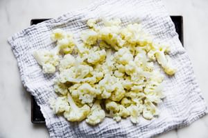 steamed cauliflower on a kitchen towel
