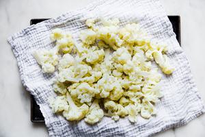 steamed cauliflower on a kitchen towel