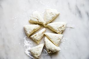raw cauliflower gnocchi dough on the counter cut into eight pieces