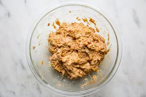 ground meat with spices in a glass bowl for chicken shawarma meatballs