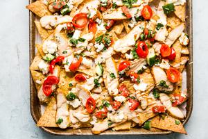 chicken shawarma nachos shown on a sheet pan
