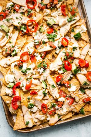 chicken shawarma nachos with tortilla chips and tahini and feta