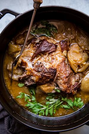 Pork shoulder roast in a large pot shallots, with fennel, Garlic, apple cider, Apple cider vinegar, Chicken stock and Apples