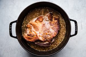 Pork shoulder roast in a large pot shallots, with fennel, Garlic, apple cider, Apple cider vinegar, Chicken stock and Apples