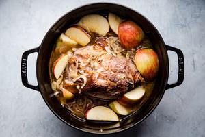 Pork shoulder roast in a large pot shallots, with fennel, Garlic, apple cider, Apple cider vinegar, Chicken stock and Apples