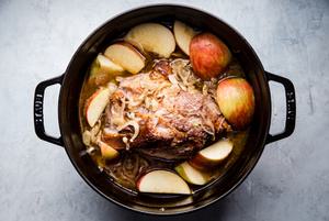 Pork shoulder roast in a large pot shallots, with fennel, Garlic, apple cider, Apple cider vinegar, Chicken stock and Apples