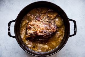 Pork shoulder roast in a large pot shallots, with fennel, Garlic, apple cider, Apple cider vinegar, Chicken stock and Apples
