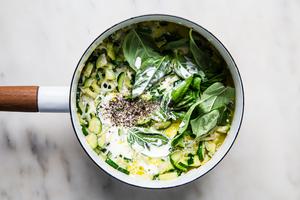 zucchini, cream, salt, parmesan, pepper, basil and garlic in a pot for creamy pasta sauce