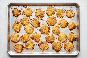 boiled potatoes smashed then baked seasoned with olive oil, salt and garlic on a baking sheet