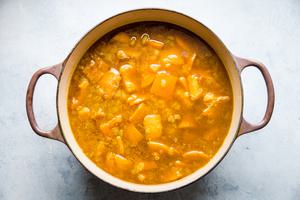 cooked pumpkin and butternut squash in a large pot for pumpkin soup