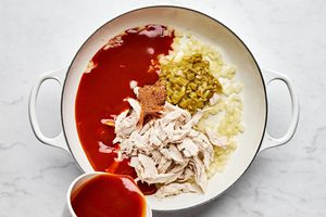 chicken, taco seasoning, green chilies and enchilada sauce in a skillet, to make a simple enchilada skillet