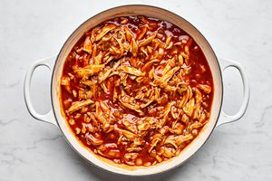 chicken, taco seasoning, green chilies, enchilada sauce and sliced corn tortillas stirred together in a skillet