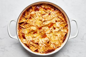 chicken enchilada skillet made with plenty of cheese, chicken, red enchilada sauce and corn tortillas fresh out of the oven