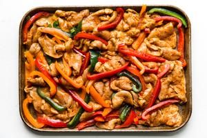 freezer chicken fajita meal on a sheet pan for dinner with tortillas and avocado and bell peppers