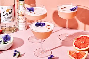 grapefruit pisco sour with orange bitters cocktails garnished with  flowers