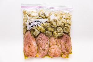 Easy freezer meals with Greek lemon chicken and potatoes in a freezer bag.