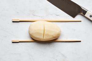 peel potatoes being thinly sliced crosswise