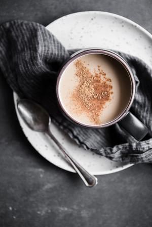 A mug of Chai tea made with Homemade Chai tea concentrate with a spoon