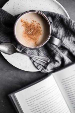A mug of Chai tea made with Homemade Chai tea concentrate with a spoon