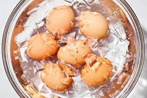 boiled eggs cooling down in an ice bath