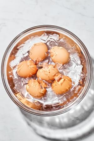 boiled eggs cooling down in an ice bath