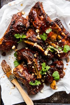 Instant pot baby back ribs with cilantro ginger, garlic, honey and lime sauce with peanuts