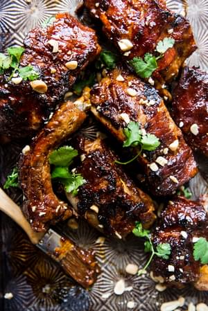 Instant pot baby back ribs with cilantro ginger, garlic, honey and lime sauce with peanuts