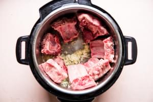 4 lbs pork ribs salted in an instant pot with onions