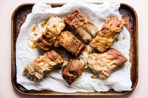 cooked pork ribs on parchment paper