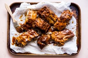 cooked pork ribs with sauce on parchment paper