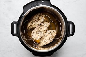 juicy chicken breast in an instant pot seasoned withItalian seasoning, garlic powder, brown sugar, salt, and pepper