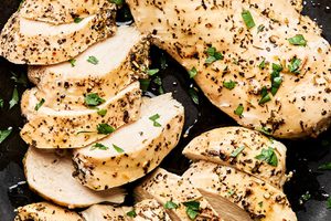 perfectly cooked juicy chicken breast cooked in the instant pot and sliced and arranged on a plate