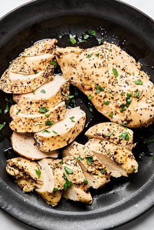 perfectly cooked juicy chicken breast cooked in the instant pot and sliced and arranged on a plate