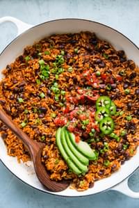 Mexican Brown Rice in a pan with avocado, and black beans