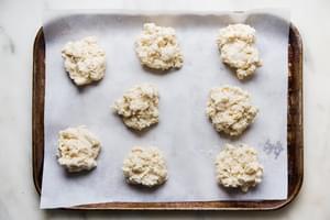 baking sheet lined with parchment paper topped with shortcake dough