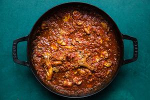 homemade mushroom ragù in a saucepan made with vegetables, mushrooms, spices, crushed tomatoes and redwine