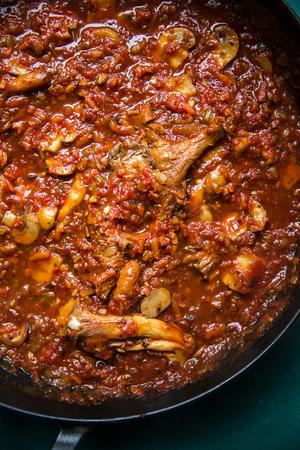 homemade mushroom ragù in a saucepan made with vegetables, mushrooms, spices, crushed tomatoes and redwine