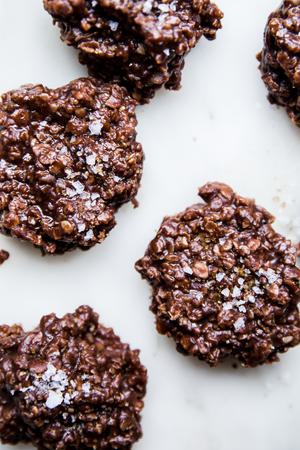 peanut butter and chocolatey no-bake cookies topped with flaky sea salt and raw sugar on the counter