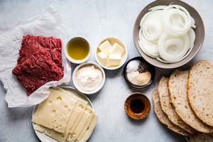 butter, mayo, ground beef, spices, worcestershire, sourdough, onions and swiss cheese in pre bowls for patty melts