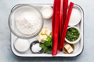 flour, rhubarb, mint, butter, milk and sugar for rhubarb cobbler with mint