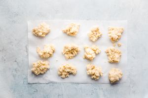cobbler dough in small balls on parchment paper
