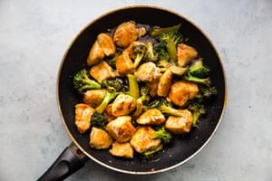 sesame chicken with broccoli in a pan