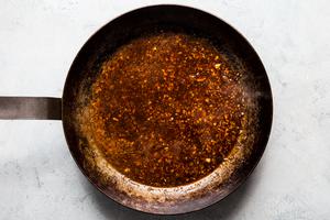 Sauce for sesame garlic ramen noodles in a satué pan. soy sauce, oyster sauce, rice vinegar, brown sugar, sriracha