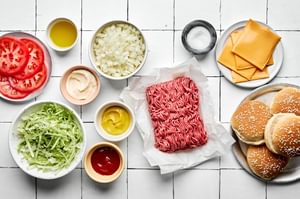 ingredients laid out on the counter to make smash burgers and homemade burger sauce