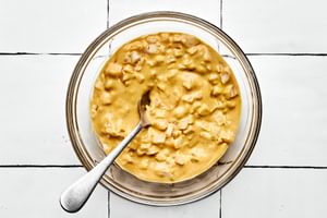 a bowl of burger sauce made with mustard, mayonnaise, ketchup, and chopped onion