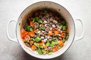 ground beef, chopped bell peppers, onions cooked in a soup pot for stuffed pepper soup