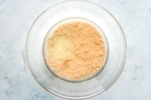 ingredients for tahini sauce in a glass bowl