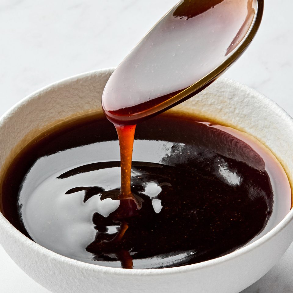 Glossy and rich Homemade teriyaki sauce dripping smoothly from a spoon